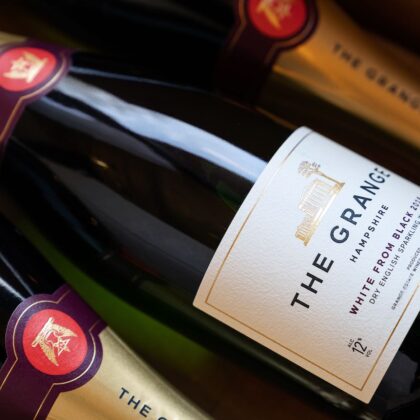 3 bottle of The Grange WHITE FROM BLACK Englsh sparkling Pinot Meunier wine lying in a case